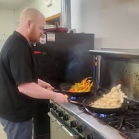 Zach cooking on the grill